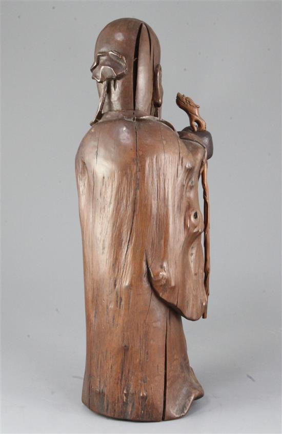 A large Chinese hardwood standing figure of Shou Lao, 18th / 19th century, height 41cm